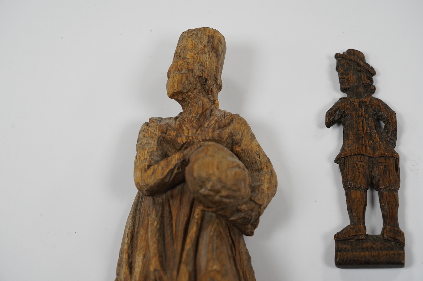 Two 17th century or earlier, European carved oak figures, tallest 20cm high. Condition - fair considering age